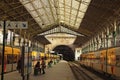 Ancient Sao Bento railway station with typical yellow trains near the platform